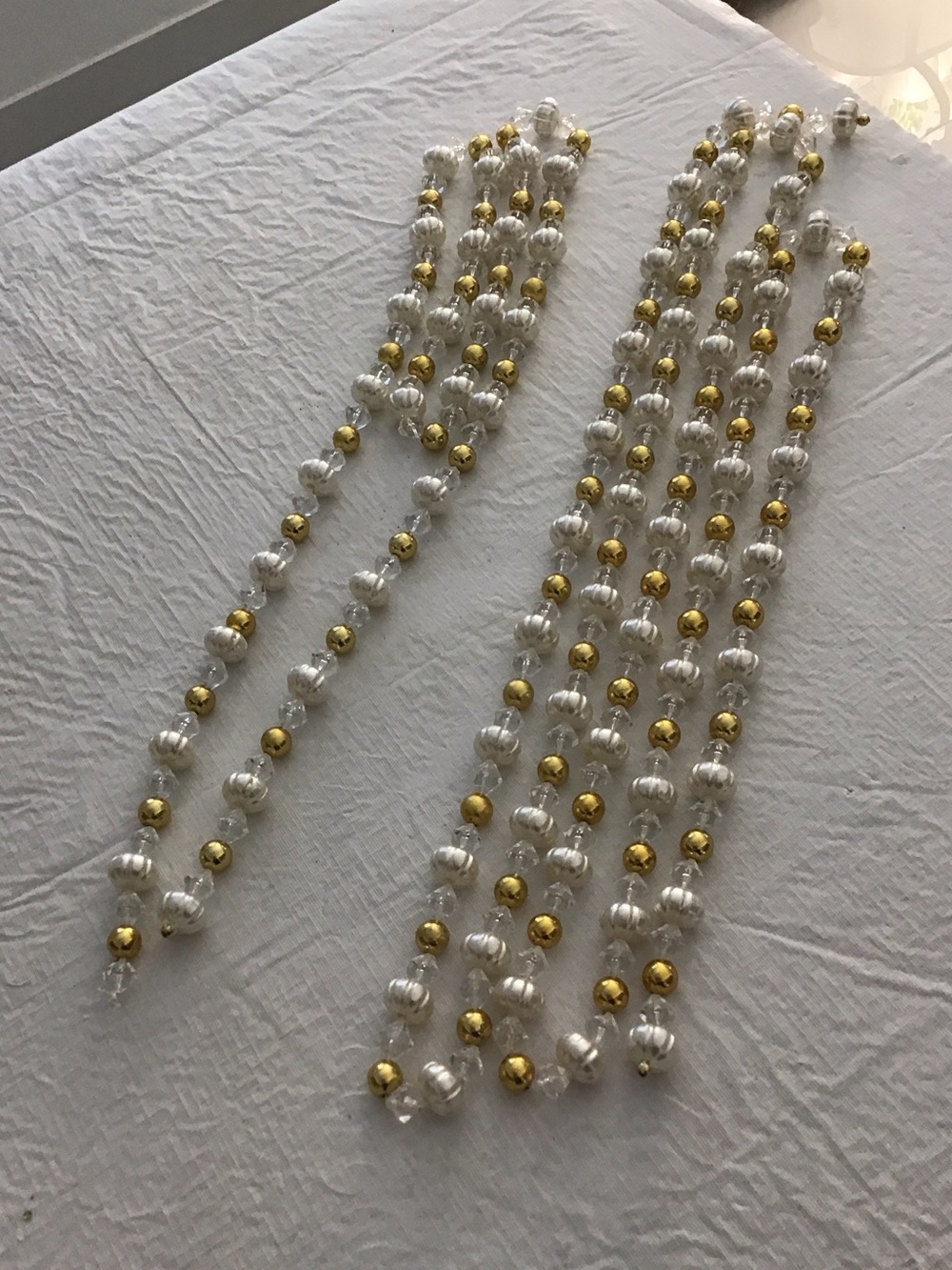 2 Strands of White & Gold Plastic Beads.  ##